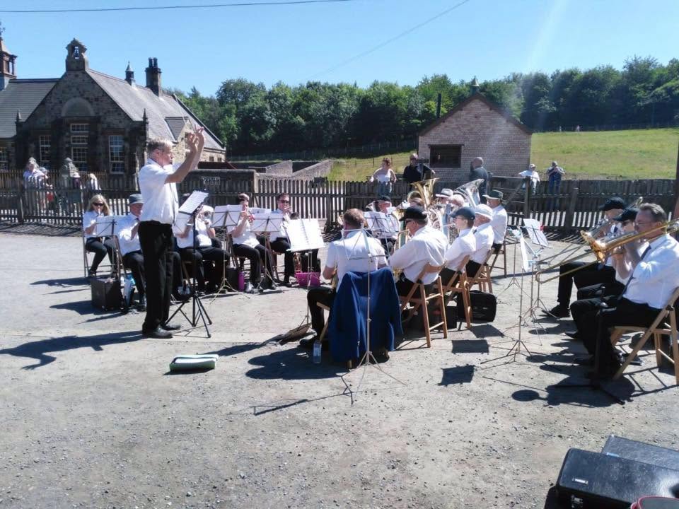 Hexham Brass members welcoming people into the band